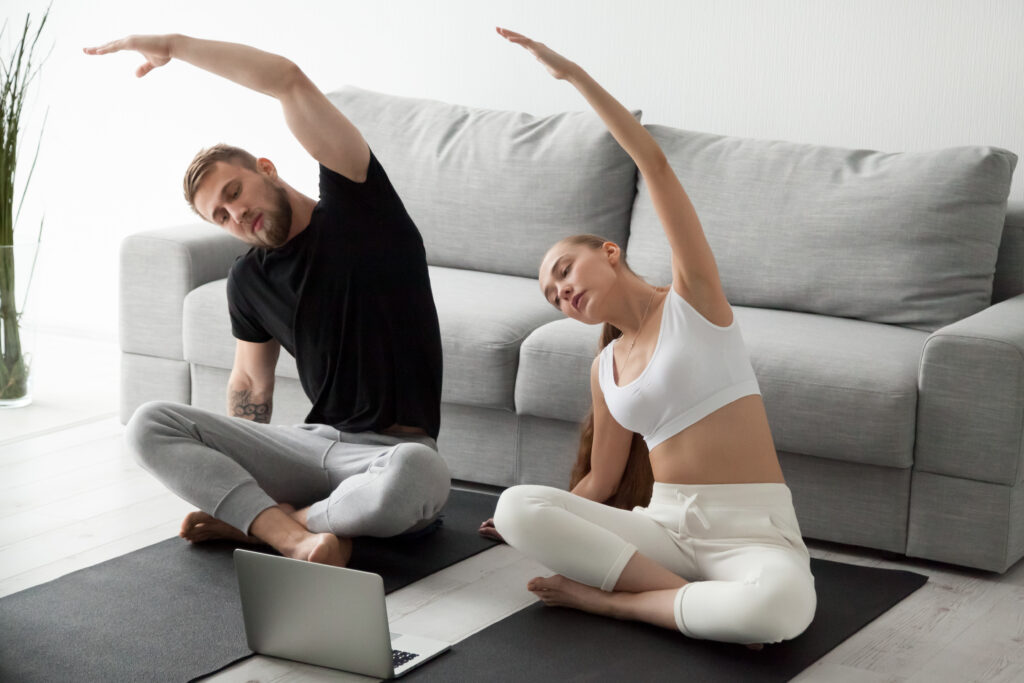The couple, practicing an online IVF yoga program from Thrive