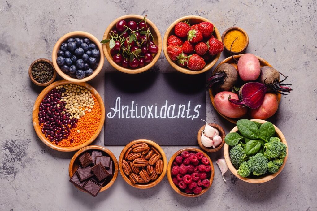 Antioxidants are found in foods such as fruits (especially berries, apples, grapes and oranges), vegies (leafy green vegetables, broccoli, spinach and kale) nuts, kidney beans