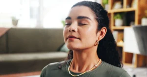 Woman meditating with eyes closed.